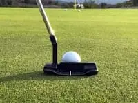 putting to hole close up